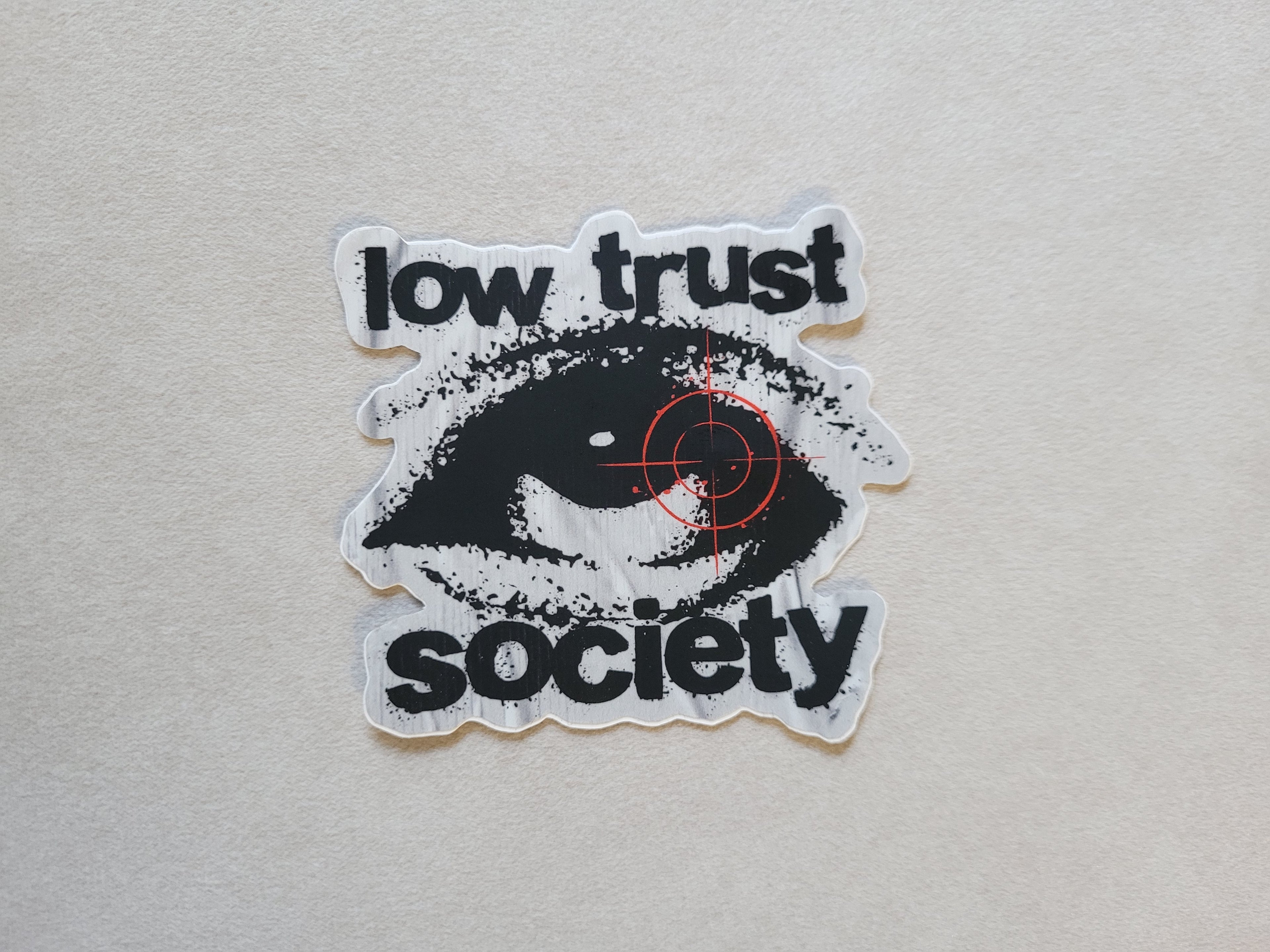 Low Trust Society Logo Slap
